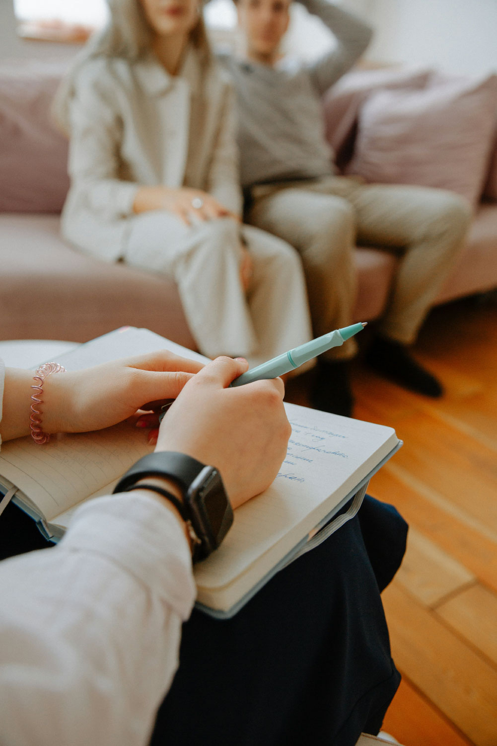 New Jersey Divorce Therapy showing a therapist taking notes during a marriage counseling session