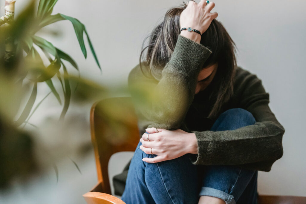 Obsessive Compulsive Disorder Therapy woman holding her head in frustration