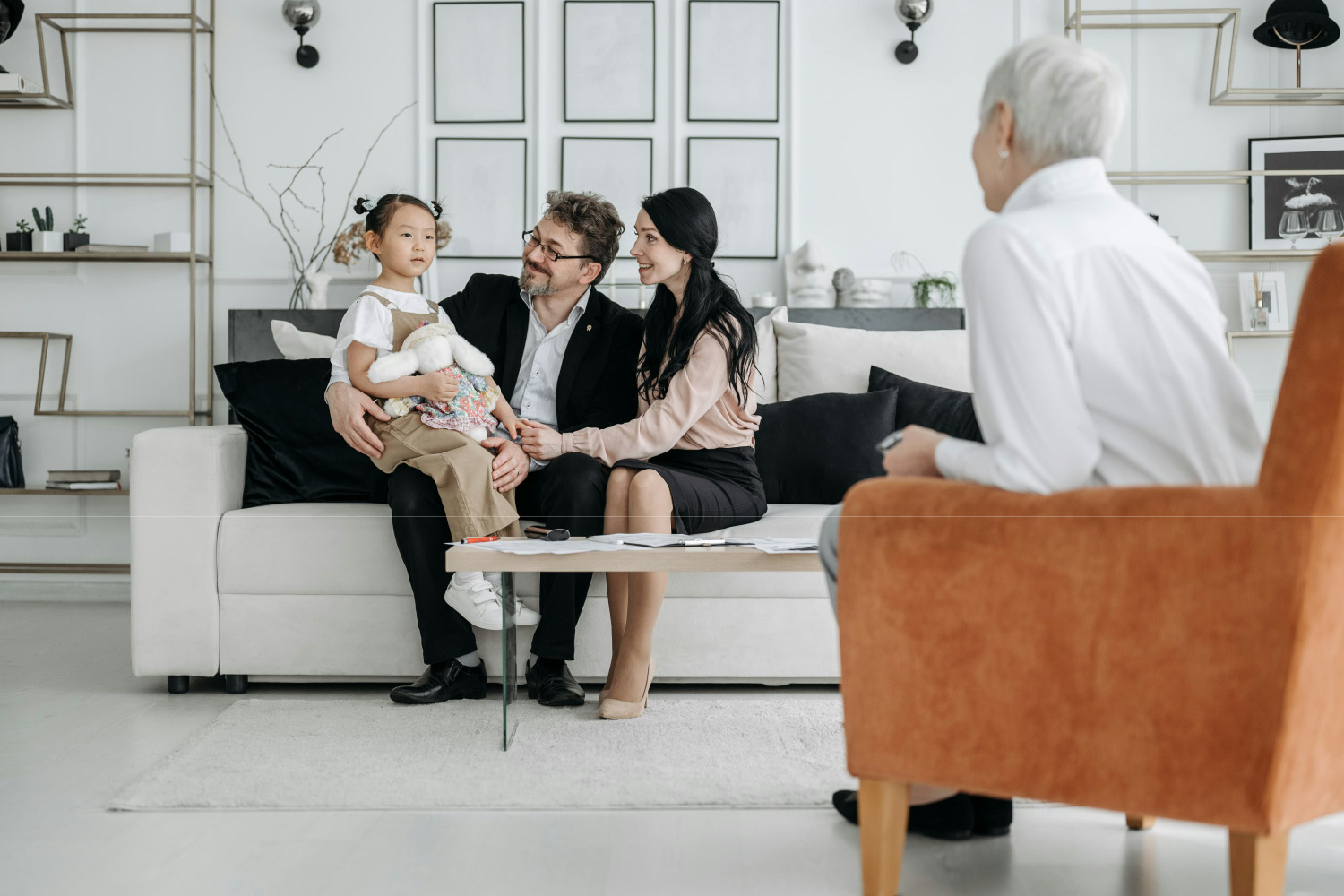 holistic family therapy showing a young family experiencing mental health counseling