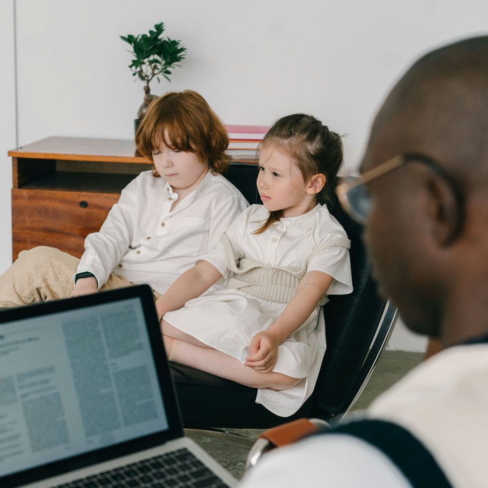 New-Jersey-Family-Therapy-at-Behaved-Brain-2 New Jersey Family Therapy at Behaved Brain two children having a therapy session with a therapist taking notes