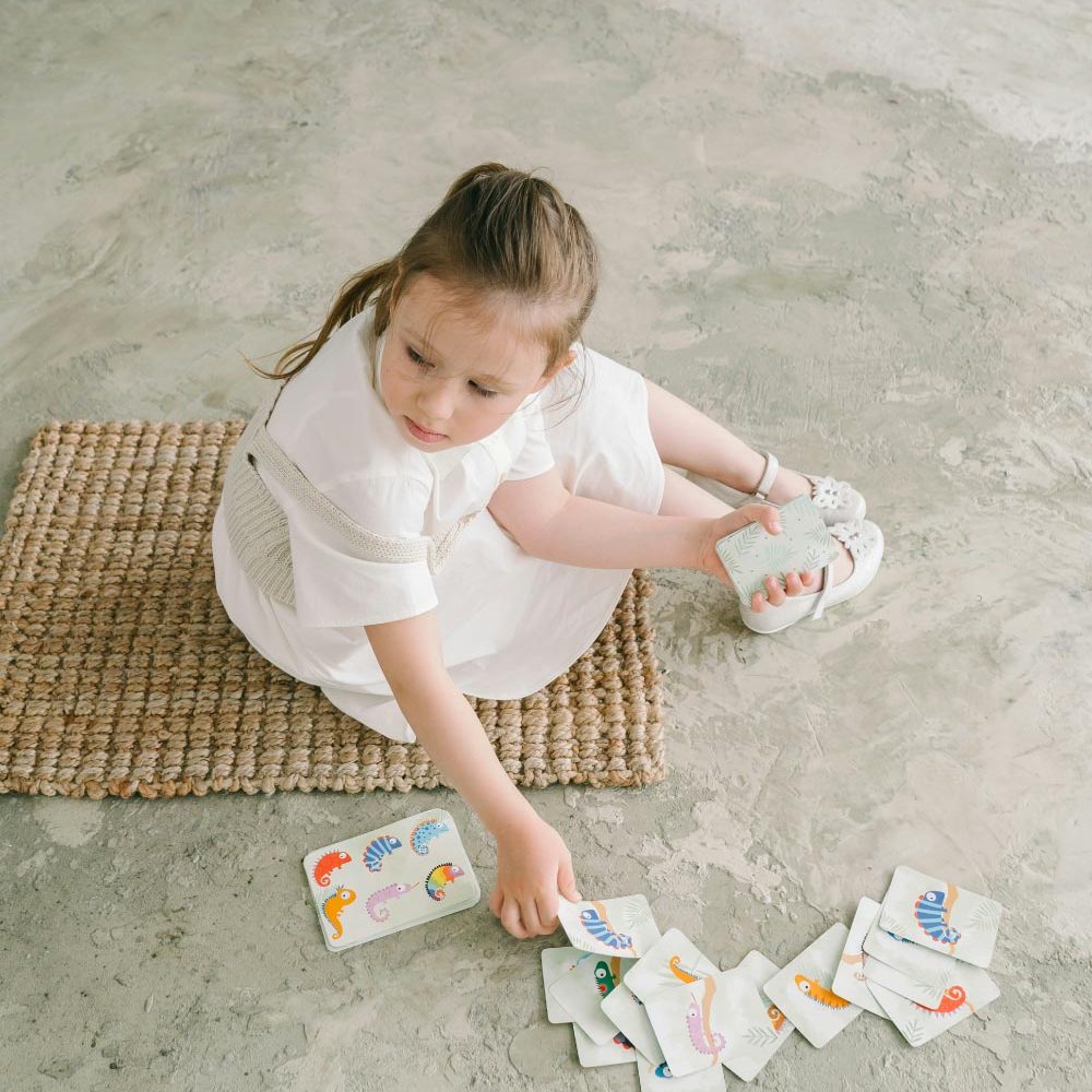 Obsessive Compulsive Disorder Therapy photo of a girl playing with cards in a therapy session